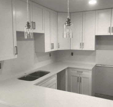 kitchen sink and cabinets with gray theme